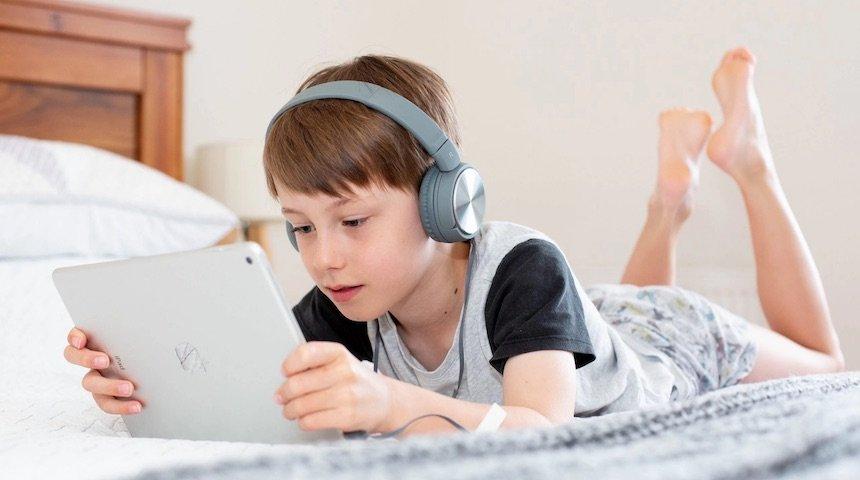 a picture showing a boy playing video games